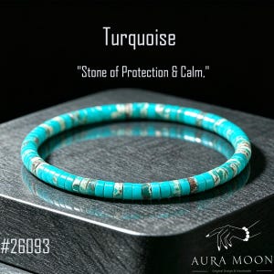 May include: A turquoise beaded bracelet made of small, flat, disc-shaped stones with natural brown and white veining. The text above reads Turquoise and Stone of Protection & Calm, with the number 26093 and the brand name Aura Moon visible.