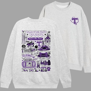 May include: A light gray crewneck sweatshirt featuring a purple graphic on the front left chest of a T inside the state of Texas. The back displays a detailed purple illustration of Tarleton State University landmarks, buildings, and icons.