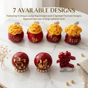 May include: A collection of seven decorative items, including four red lucky bag designs with gold accents and three symbol-themed designs. The large spheres are approximately 2.36 inches in diameter. The text on the image says "7 AVAILABLE DESIGNS".
