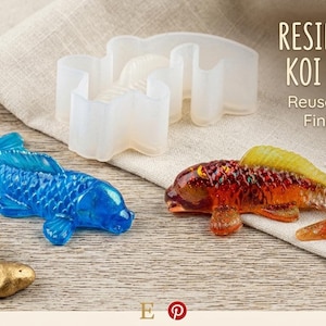 May include: A resin artist's koi mold set with finished samples. The image shows a blue and an orange koi fish, along with a white silicone mold. The text reads "Resin Artist's Koi Mold Set".