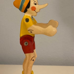 Toy  Pinocchio  Wood  yellow red black white   | Größe: 6,2 x 11,5  x 4,0 cm (b x h x s)  approx. 22,0 gr.