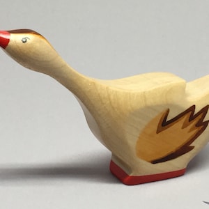 Toy Goose Wooden - with the head up and brown wings Size: 11,0 x 6,8 x 2,2 cm (b x h x s)  capprox. 25,0  gr.