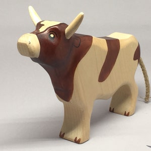 Toy bull brown white colourful head up image 3