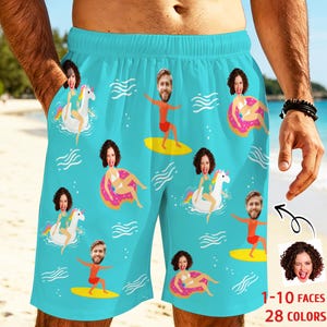 May include: Light blue swim trunks featuring a repeating pattern of custom faces on cartoon bodies. The print includes figures riding yellow surfboards, sitting on pink donut floats, and riding white unicorns, all set against a wavy water background.