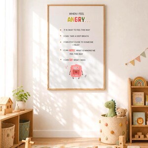 May include: A vertical wall poster with the title WHEN I FEEL ANGRY in colourful letters. It lists five coping strategies with bullet points and features a small, pink, wide-mouthed monster illustration at the bottom on a white background.
