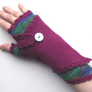 May include: Purple fingerless gloves with a green and blue striped cuff and a white button.