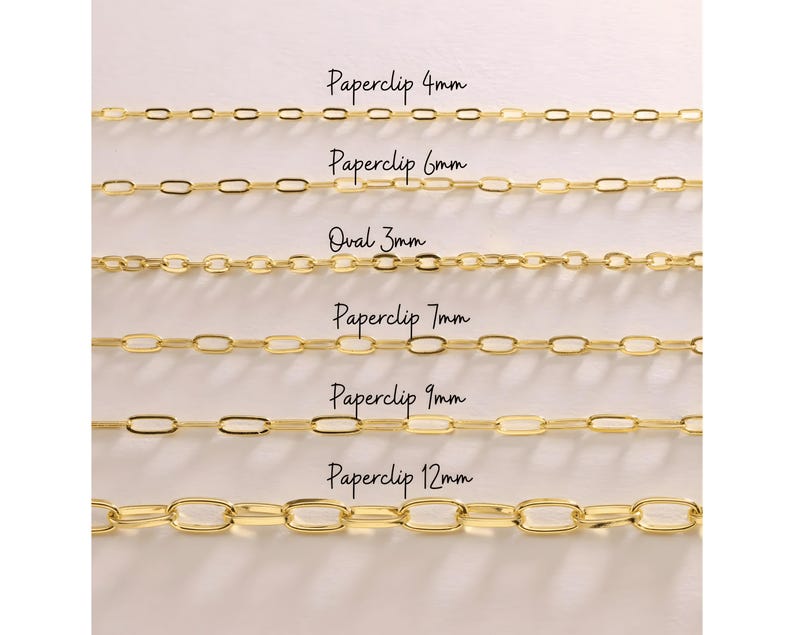 May include: A close-up of six gold-colored chain necklaces. The chains vary in style and size, with text labels indicating the type and millimeter size: Paperclip 4mm, Paperclip 6mm, Oval 3mm, Paperclip 7mm, Paperclip 9mm, and Paperclip 12mm.