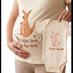 May include: A white ceramic mug with a black handle and the text "But First, Coffee" in a black, bold font. The mug is on a white surface.