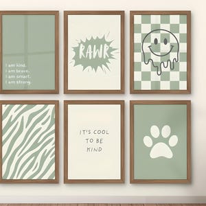 May include: Six framed wall art prints with a minimalist design. The prints feature various designs, including text that reads "I am kind. I am brave. I am smart. I am strong.", a "RAWR" graphic, a melting smiley face, zebra stripes, the text "IT'S COOL TO BE KIND", and a paw print.