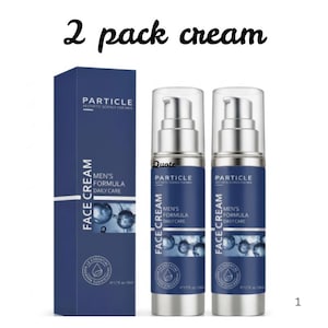 May include: A two-pack of Particle face cream featuring one tall rectangular blue box and two cylindrical pump bottles. The packaging is dark blue with white text reading Face Cream Men's Formula Daily Care and 1.7 fl. oz. volume.