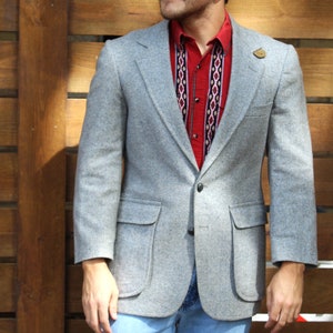 What is the purpose of the elbow patch on tweed professor jackets