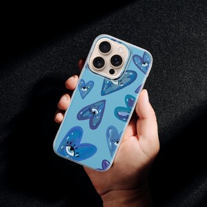 Hjärtliknande telefonskal Comme Des Garçons för iPhone 17 Pro Max, 16e, 15, 14, 13 och Samsung S26 Ultra, S25 FE, A57, A56, Pixel 10, 9A bild 4