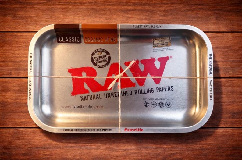 May include: A set of three ceramic mugs with a speckled, matte finish. The mugs are in cream, light grey, and dark grey. Each mug has a simple, minimalist design, ideal for coffee or tea.