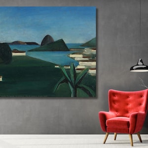 May include: A rectangular canvas painting depicting a coastal landscape with a deep blue sea, dark green hills, and a clear blue sky. The scene features a prominent conical mountain peak, a large dark tree on the left, and a green plant in the foreground.