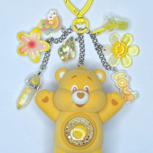 May include: A set of three ceramic mugs with a speckled, matte finish. The mugs are in shades of cream, light grey, and dark grey. Each mug has a simple, minimalist design, ideal for coffee or tea.