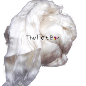 May include: A large amount of white silk fiber, also known as raw silk, in a loose pile. The silk is soft and fluffy, and it is perfect for spinning or felting.