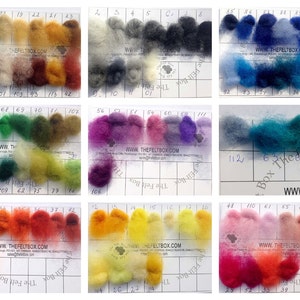 May include: A color chart of wool roving with 112 different colors. The wool is arranged in rows and columns, with each color labeled with a number. The chart is on a white background with black grid lines. The website address "www.thefeltbox.com" is printed on the chart.