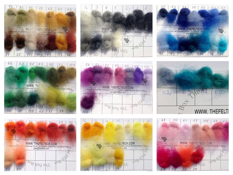 May include: A color chart of wool roving with 112 different colors. The wool is arranged in rows and columns, with each color labeled with a number. The chart is on a white background with black grid lines. The website address "www.thefeltbox.com" is printed on the chart.
