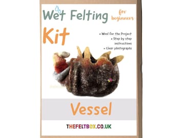 May include: A brown cardboard box with a label that says "Wet Felting Kit for beginners". The label also includes a picture of a felted vessel, the words "Vessel" and the website "THEFELTBOX.CO.UK".