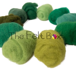 May include: A collection of ten different shades of green wool roving, arranged in a circle. The wool is soft and fluffy, and the colors range from light green to dark green.
