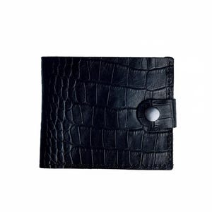 May include: A black wallet with a crocodile skin texture. The wallet has a snap closure and a rectangular shape. The wallet is made of a dark material, likely leather.