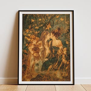 May include: Framed art print featuring a vintage-style illustration of two women kissing. The artwork has a warm color palette with shades of gold, green, and brown. The women are surrounded by floral elements, creating a romantic and classical aesthetic.