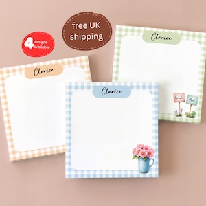 May include: Four square notepads with gingham borders in peach, green, and blue. Each notepad has a white interior and a label with the name "Clarice". One notepad features a blue vase with pink flowers. The text "4 designs available" is also present.