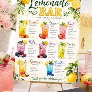 May include: A decorative sign for a lemonade bar, featuring a variety of colorful lemonade recipes. The sign includes the text "Lemonade Bar" and "Thank you for celebrating!" on a small gold easel.