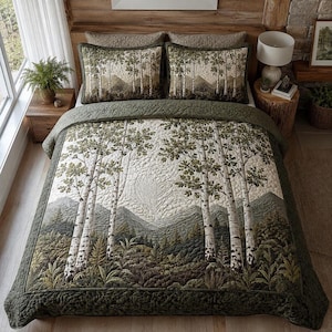 May include: A quilted bedspread and two matching pillow shams featuring a printed landscape scene of birch trees, dense forest foliage, and distant mountains in shades of olive green, brown, and cream, finished with a solid dark green border.