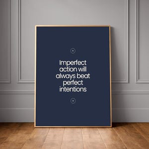 May include: A white ceramic mug with a black handle and the text "But First, Coffee" in a black, bold font. The mug is on a white surface.