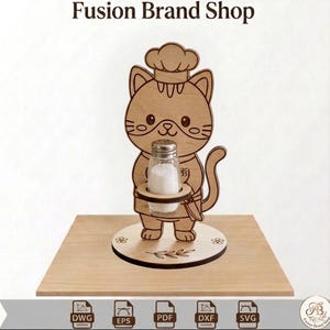 May include: A wooden cat-shaped salt and pepper shaker holder. The cat wears a chef's hat and apron, holding a glass salt shaker. The base is round with floral designs. The text "Fusion Brand Shop" is at the top.