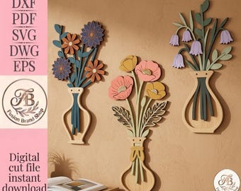 May include: Three wall-mounted decorative floral arrangements in vases, featuring layered wooden cutouts of blue, orange, pink, yellow, and purple flowers with green stems. The image includes text: DXF, PDF, SVG, DWG, EPS, Fusion Brand Shop, and Digital cut file instant download.