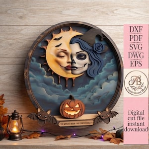May include: A circular layered wooden wall art piece featuring a crescent moon with a face, a woman with blue hair and a witch hat, a jack-o'-lantern, and two bats. The text reads: THE WITCH'S MOON - HALLOWEEN QUALITY. Includes DXF, PDF, SVG, DWG, EPS.