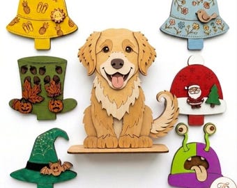May include: A wooden golden retriever figurine surrounded by six interchangeable wooden hats. The hats feature various designs including a yellow summer hat, a blue floral hat, a green autumn hat, a red Santa hat, a green witch hat, and a purple alien hat.