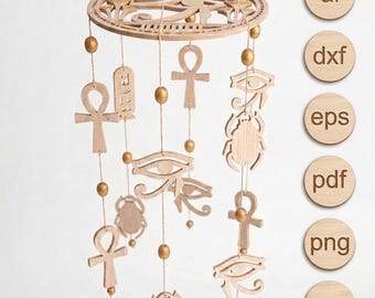 May include: A wooden mobile featuring Egyptian symbols like the Eye of Horus, ankhs, and scarabs. The mobile has a circular top with a sun design and is suspended by strings with gold beads. The text "Fusion Brand Shop" is at the bottom.