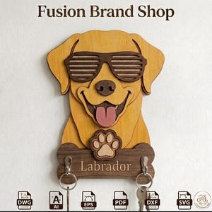 May include: Wooden Labrador key holder with sunglasses, a smiling face, and a paw print. The key holder has a bone-shaped base with the word "Labrador" and two key hooks. The text "Fusion Brand Shop" is at the top.