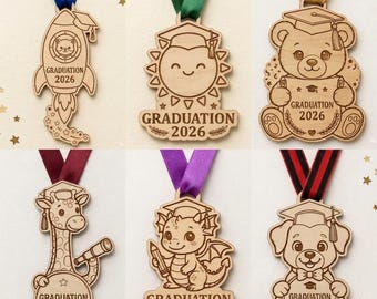 May include: Wooden graduation medals with colorful ribbons. The medals feature various designs, including a rocket, sun, bear, giraffe, dragon, and dog, all with the text "GRADUATION 2026".