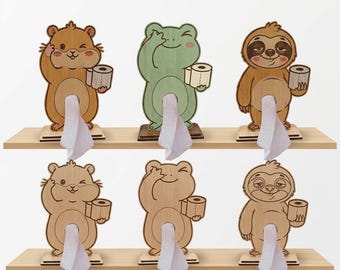 May include: Wooden tissue holders in the shape of a hamster, frog, and sloth. Each holder is holding a roll of toilet paper and dispensing tissues. The text "Fusion Brand Shop" is at the top of the image.