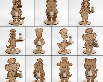 May include: A collection of wooden salt and pepper shaker holders in the shape of various animals and a chef. Each holder is light brown and features a unique animal design, including a dog, bear, and cat, holding a salt or pepper shaker.