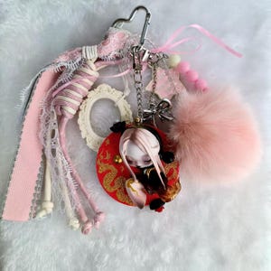 One of a Kind Handmade Pink SKULLPANDA Keychain | Unique Dragon-Themed Bag Charm with Pom Pom & Lace | Irreplaceable accessory for keys