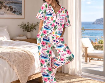 May include: A white pajama set with a short-sleeved button-down top and long pants, featuring a repeating pattern of cruise ships, pink hibiscus flowers, palm trees, anchors, and cocktails, with the name Sophie and the text Just a Girl Who Loves Cruise.