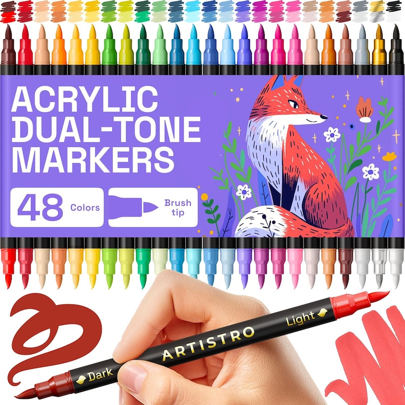 May include: A set of 48 acrylic dual-tone markers with brush tips. The box features a fox illustration and the text "Acrylic Dual-Tone Markers". One marker is held in a hand, showing dark and light color options.