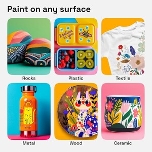 May include: An image showcasing painted items on various surfaces. Includes painted rocks, a lunchbox with fruit, a white t-shirt with floral designs, an orange metal water bottle, a wooden art piece, and a ceramic mug with floral patterns. Text reads "Paint on any surface."