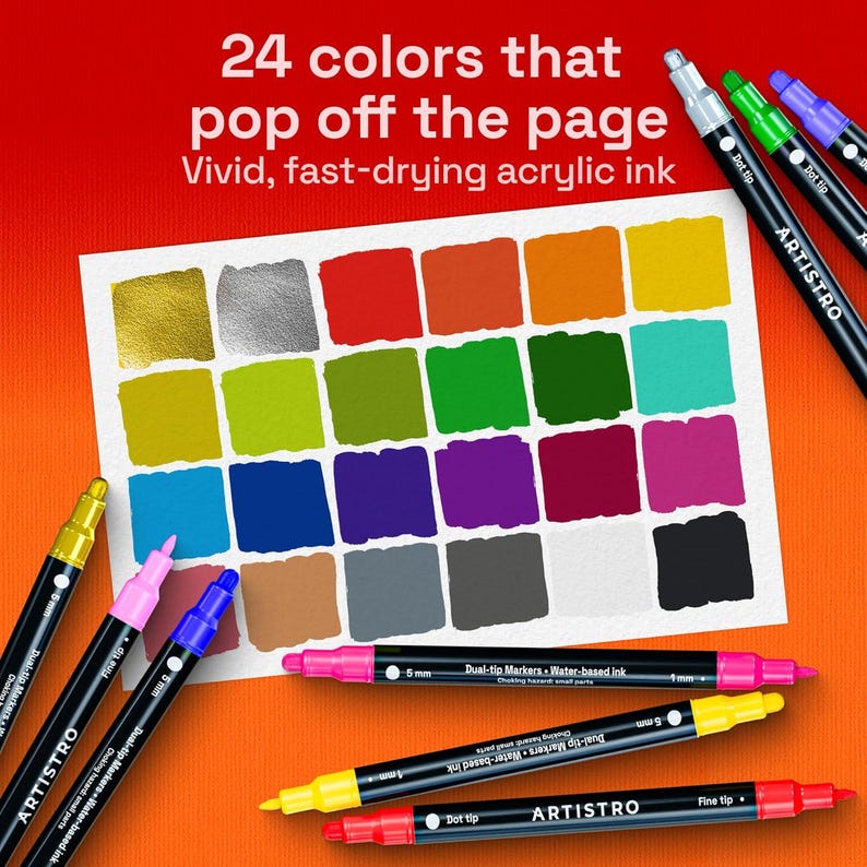 May include: A selection of ARTISTRO dual-tip markers, showcasing 24 vivid colours. The image displays a colour palette of painted squares in various shades, with the text "24 colours that pop off the page." The markers are black with colour-coded tips.