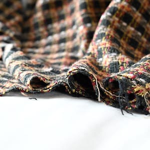 May include: A set of three ceramic mugs with a speckled, matte finish. The mugs are in shades of cream, light gray, and dark gray. Each mug has a simple, modern design and a rounded handle. Perfect for coffee or tea.