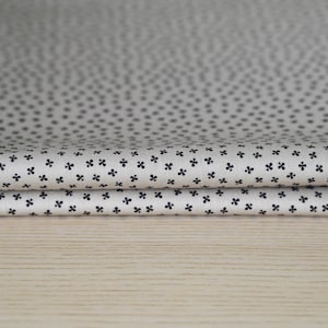 May include: A set of three ceramic nesting bowls in shades of blue, green, and white. The bowls feature a speckled glaze and a simple, modern design. The largest bowl measures approximately 6 inches in diameter.