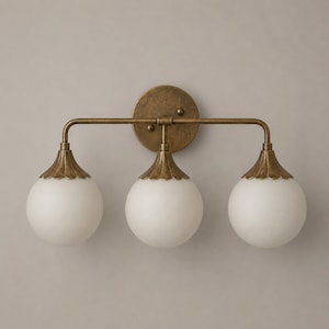 Triple Globe Vanity Wall Light in Antique Brass Finish