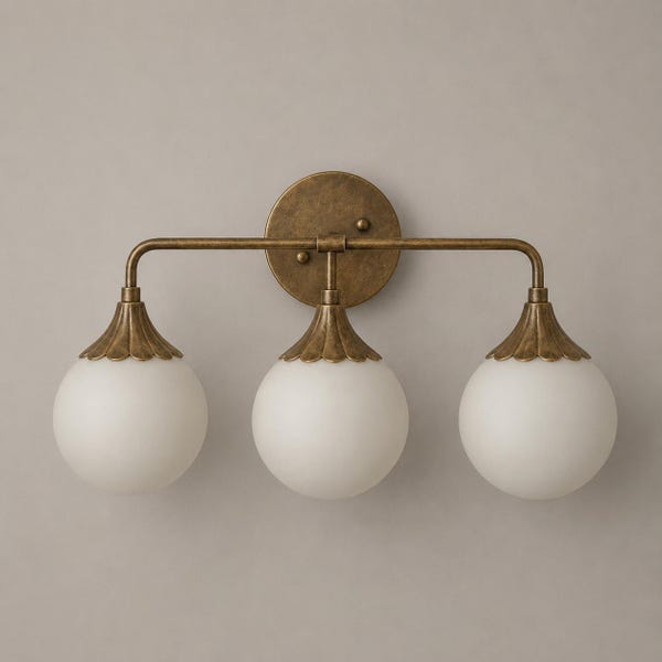 Triple Globe Vanity Wall Light in Antique Brass Finish