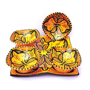 May include: A set of three ceramic mugs with a speckled, matte finish. The mugs are in shades of cream, light gray, and dark gray. Each mug has a simple, minimalist design, perfect for coffee or tea.