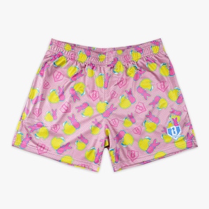May include: Pink mesh shorts with a repeating pattern of yellow chicks and pink bunnies. The shorts have a drawstring waistband and a small logo on the right leg. The shorts are a fun and playful style.